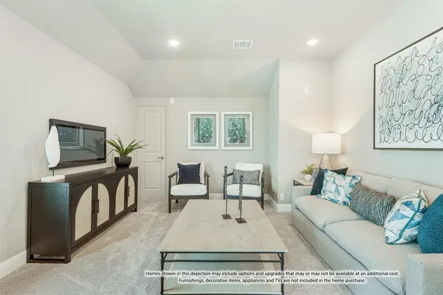 a living room with furniture a flat screen tv and a table