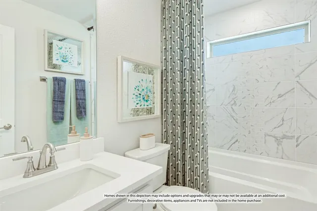 a bathroom with a bathtub and shower