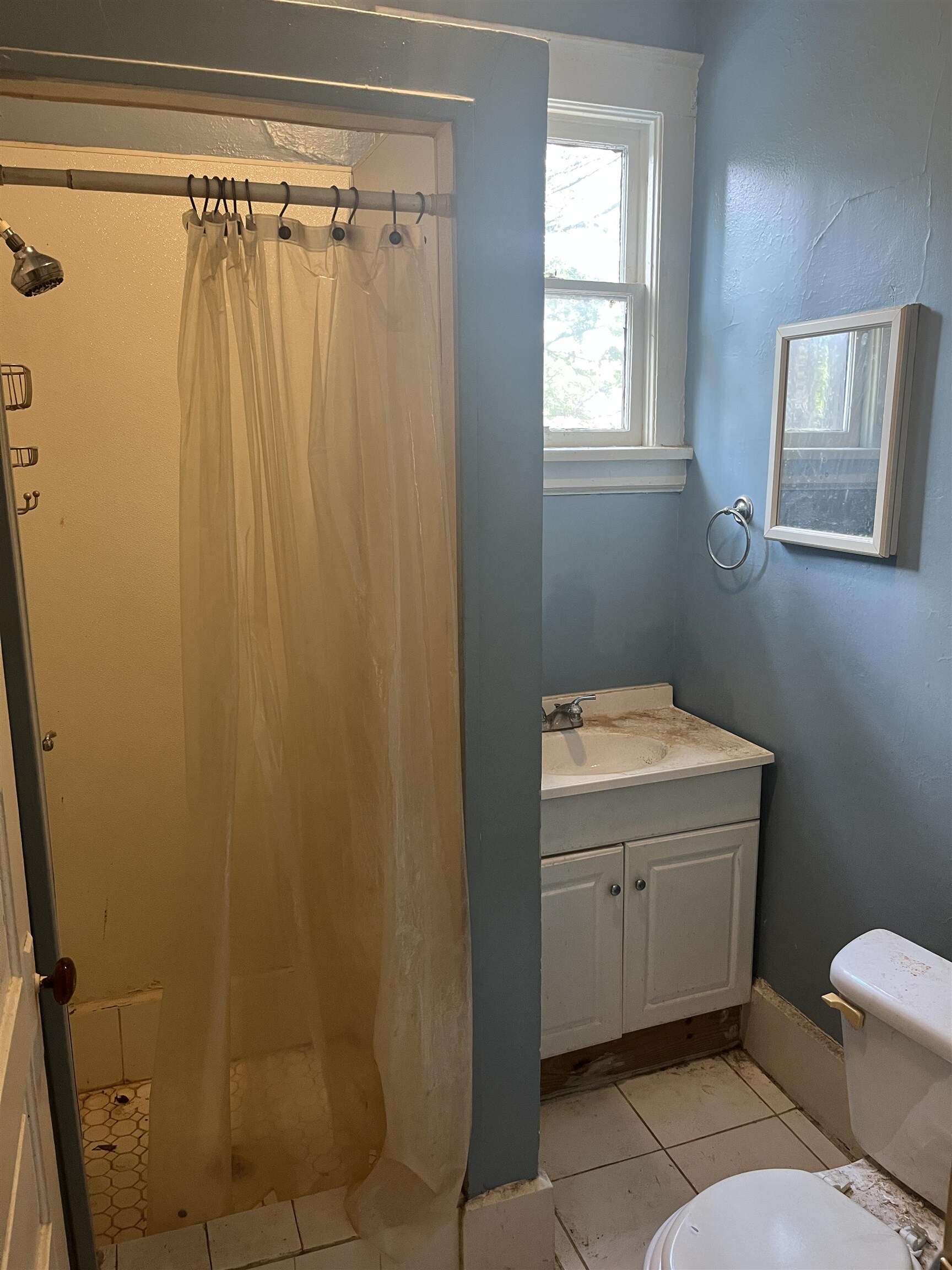 211 4th Street Mobile, AL 36611 - Photo 19 of 34 Bathroom with vanity, a stall shower, and light tile patterned flooring