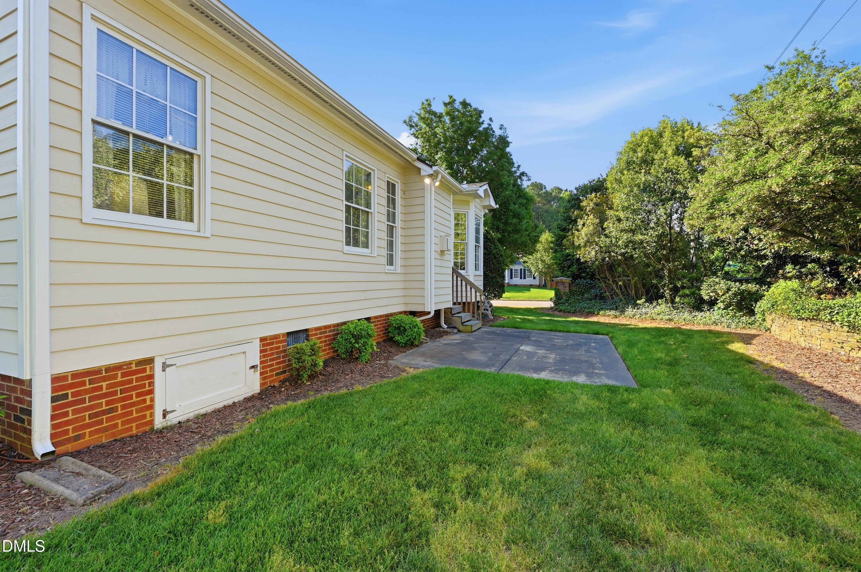 6801 Lynnoak Drive Raleigh, NC 27613 - Photo 24 of 30 a view of back yard of the house