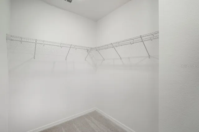 a view of a room with racks on the wall