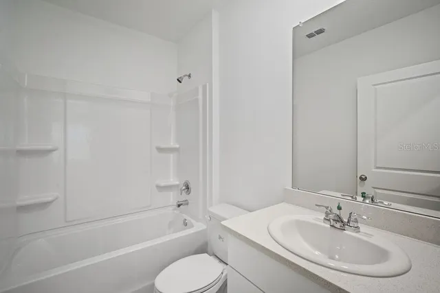a bathroom with a sink toilet and bathtub