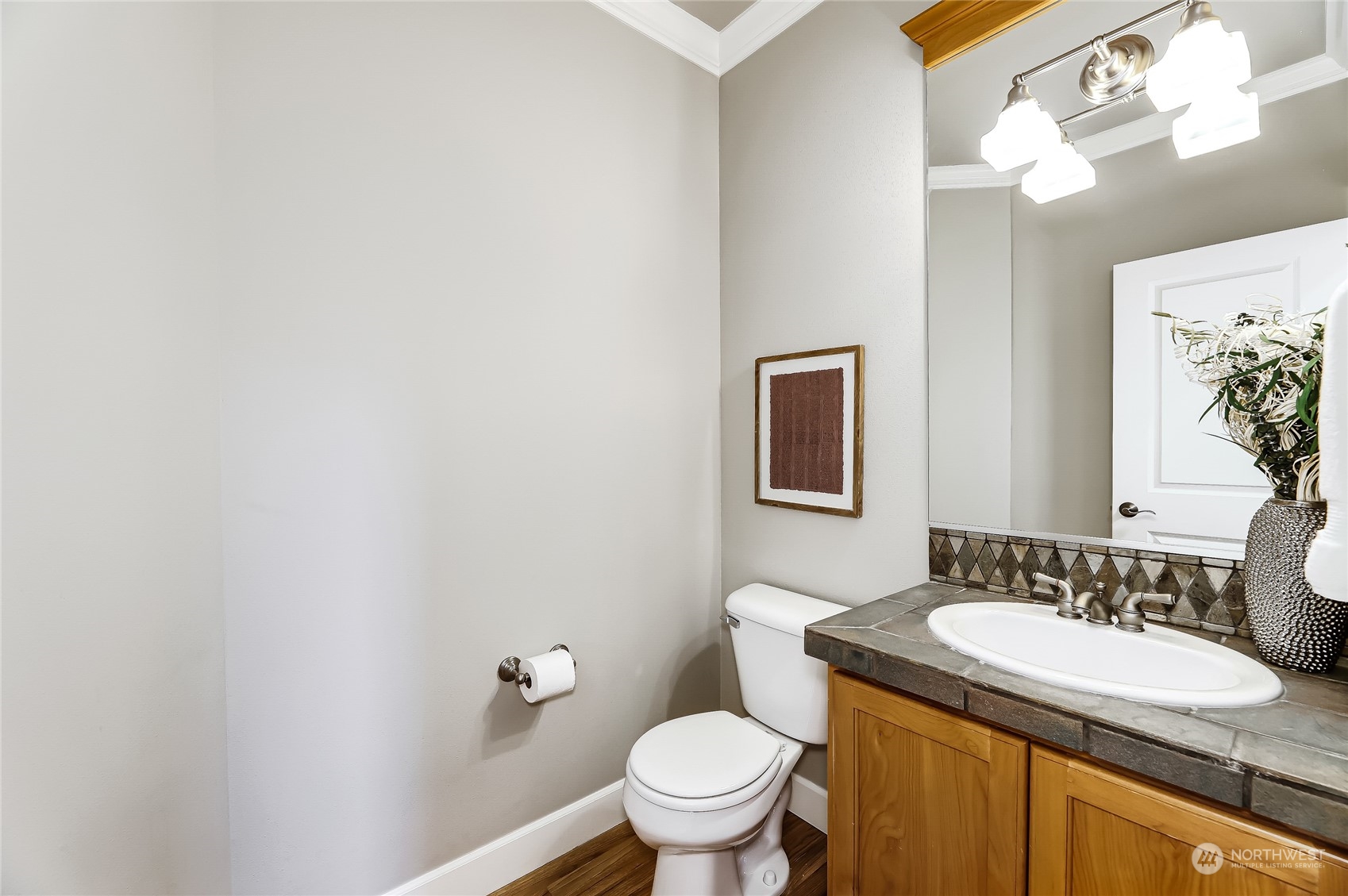 2712 Williams Avenue North Renton, WA 98056 - Photo 14 of 36 a bathroom with a granite countertop sink vanity mirror and toilet