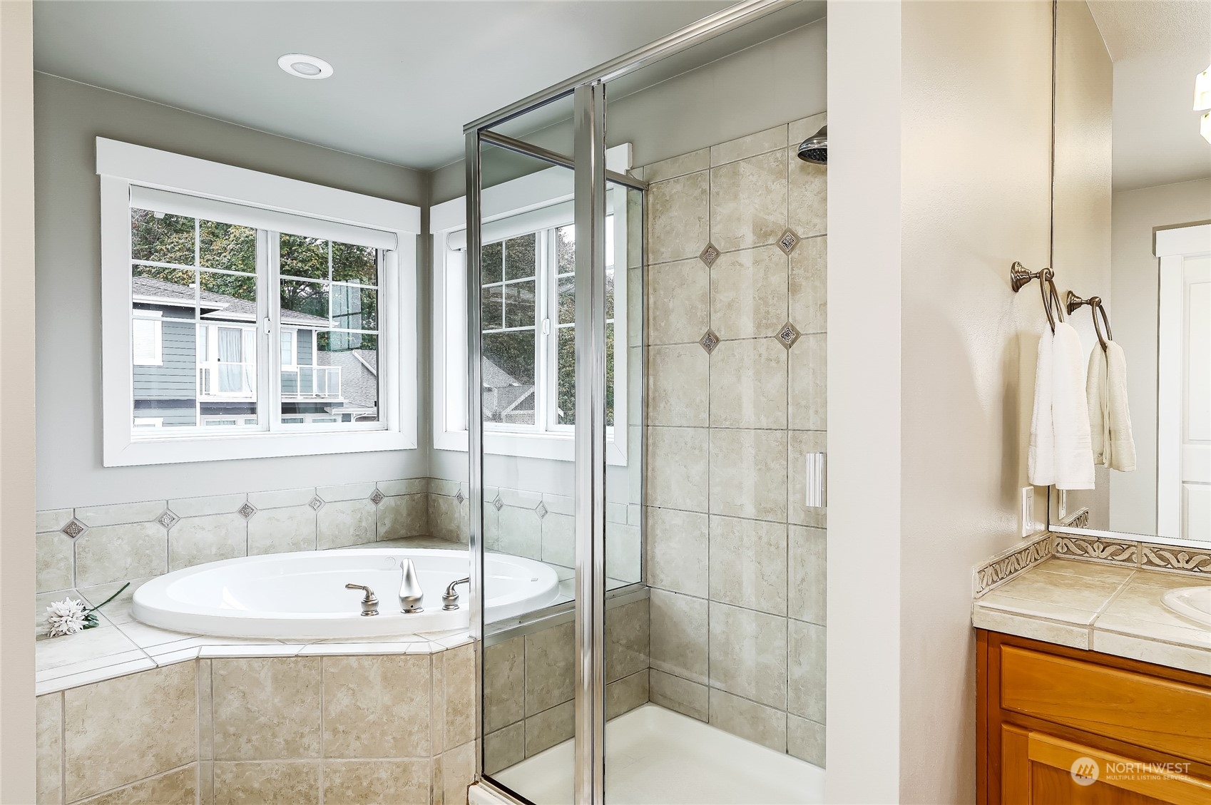2712 Williams Avenue North Renton, WA 98056 - Photo 17 of 36 a bathroom with a granite countertop tub shower and sink