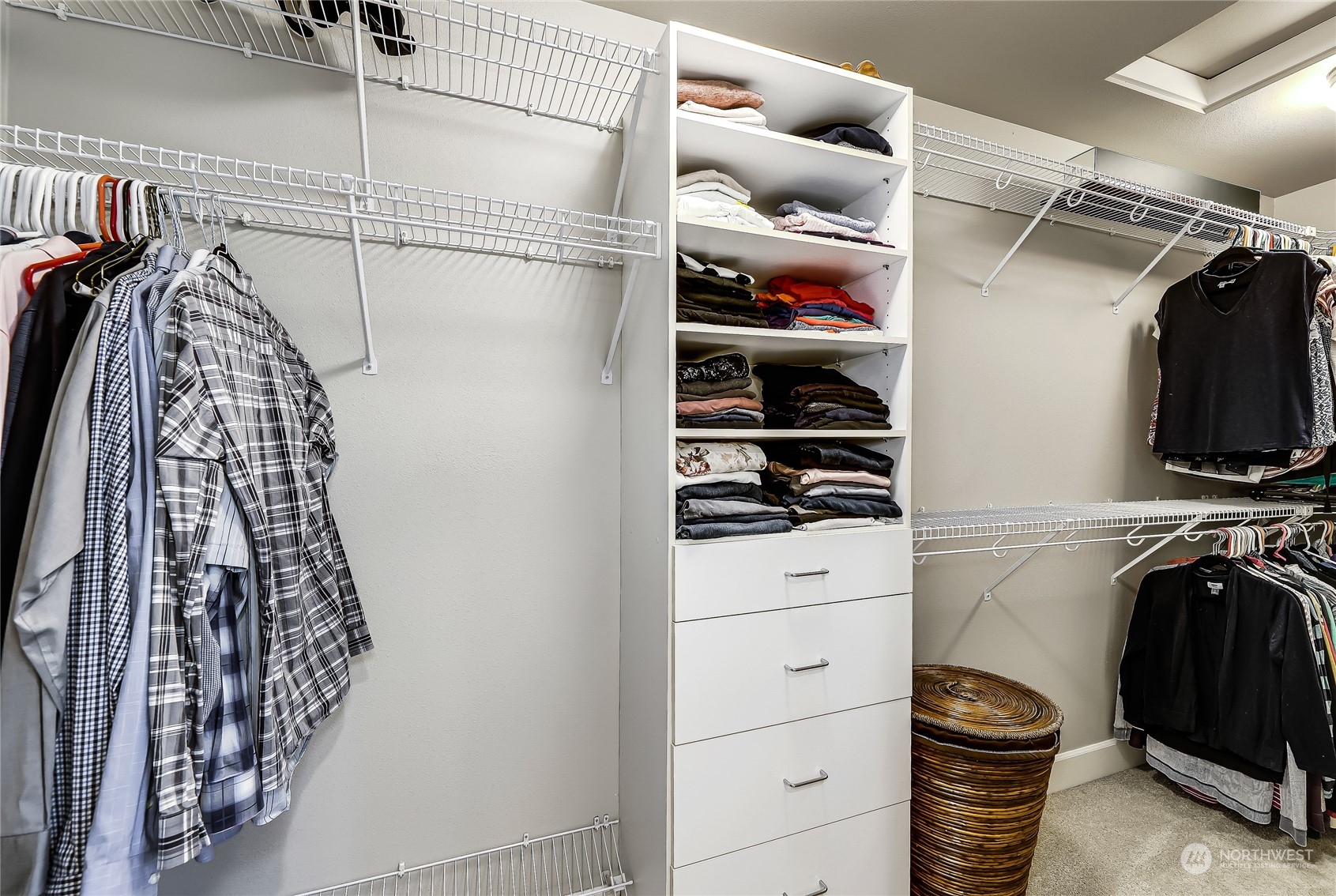 2712 Williams Avenue North Renton, WA 98056 - Photo 19 of 36 a view of walk in closet with clothes and shoes