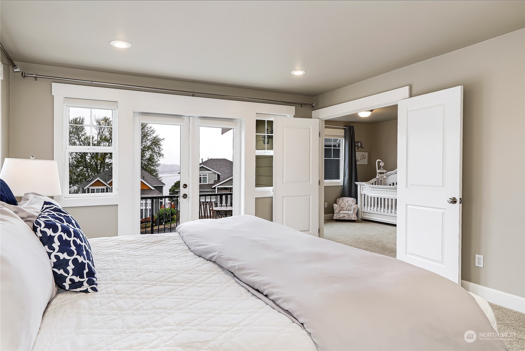 2712 Williams Avenue North Renton, WA 98056 - Photo 20 of 36 a bedroom with a large bed and a large window