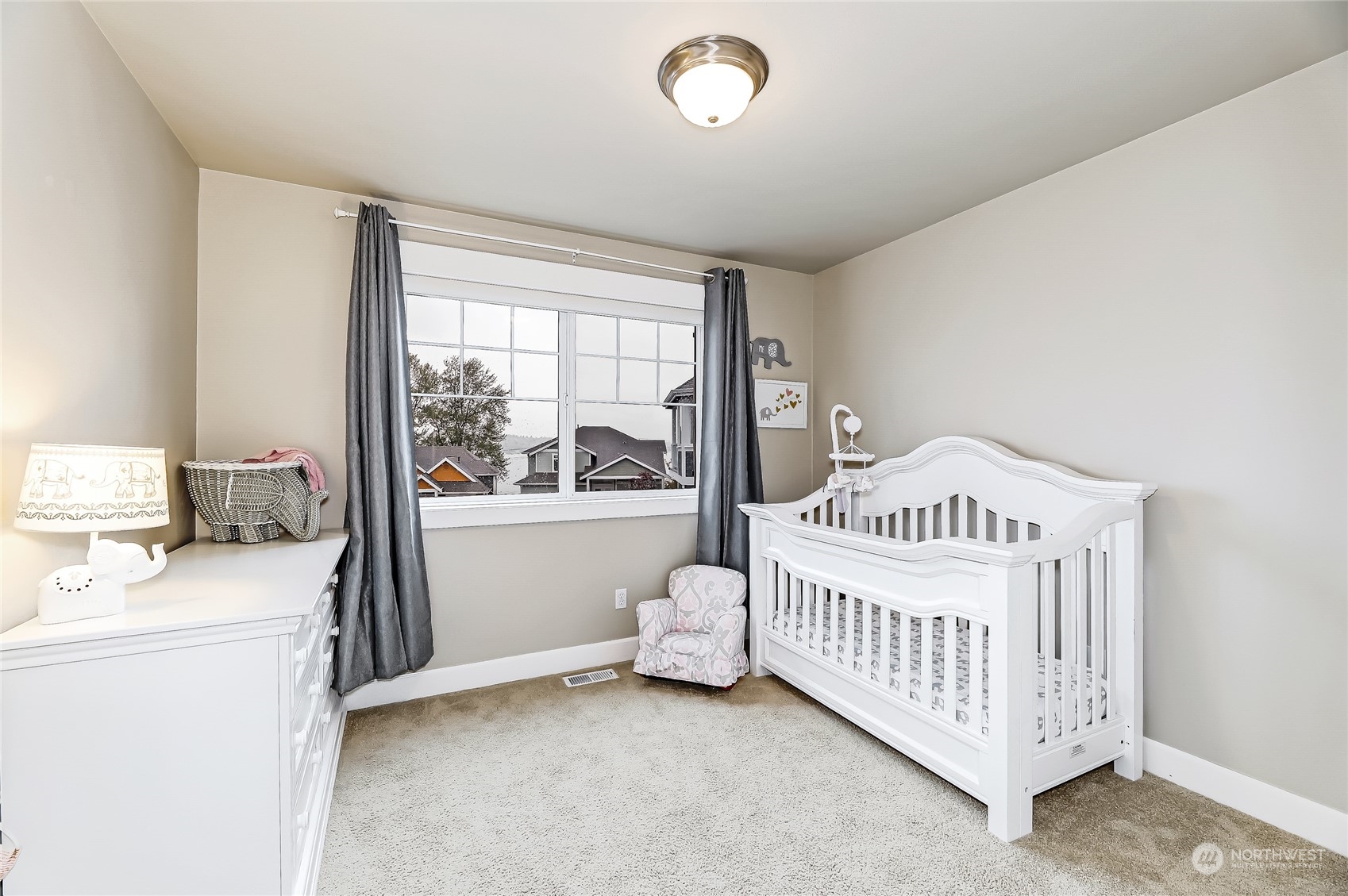 2712 Williams Avenue North Renton, WA 98056 - Photo 21 of 36 a bedroom with a bed and a window