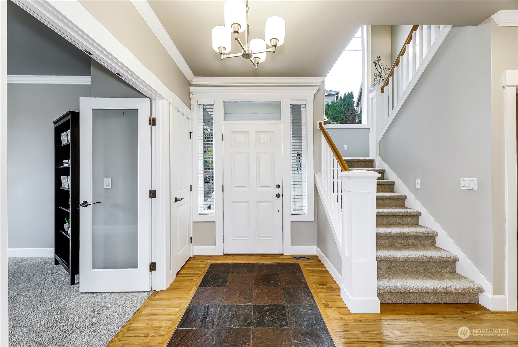 2712 Williams Avenue North Renton, WA 98056 - Photo 3 of 36 a view of a hallway with wooden floor and staircase