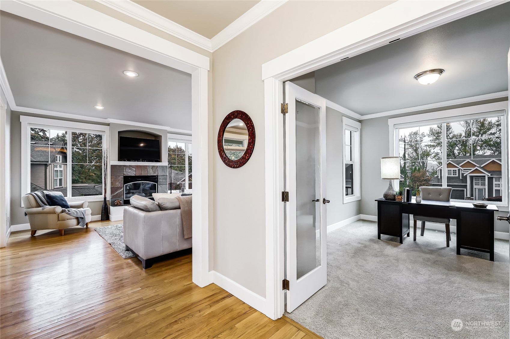 2712 Williams Avenue North Renton, WA 98056 - Photo 4 of 36 a living room with furniture a large window and a clock