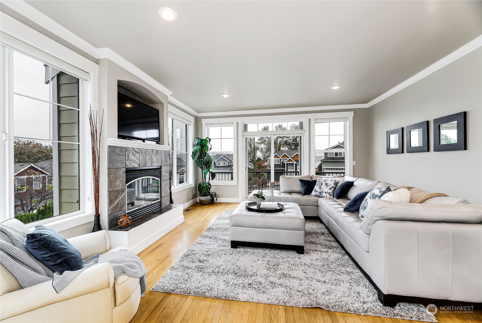 2712 Williams Avenue North Renton, WA 98056 - Photo 6 of 36 a living room with furniture large window and a fireplace