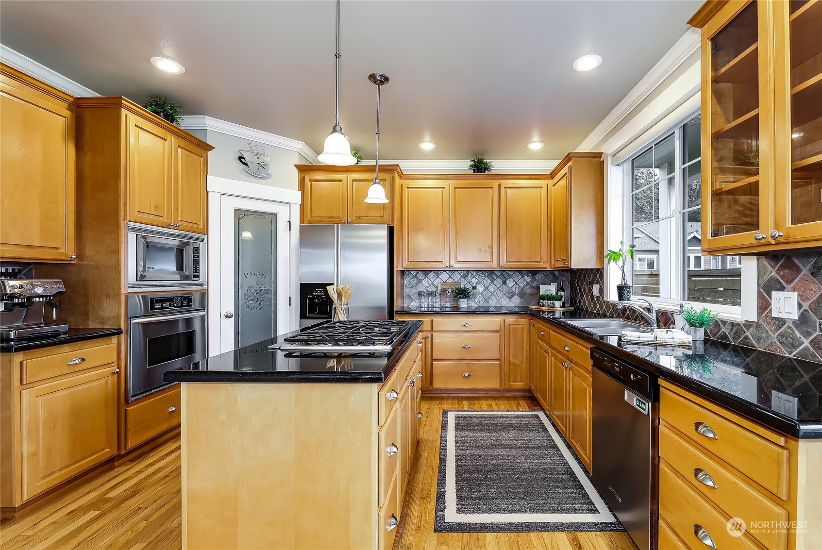 2712 Williams Avenue North Renton, WA 98056 - Photo 8 of 36 a kitchen with stainless steel appliances a sink a stove a refrigerator cabinets and a window