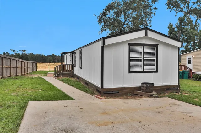 a backyard of a house with lots of green space