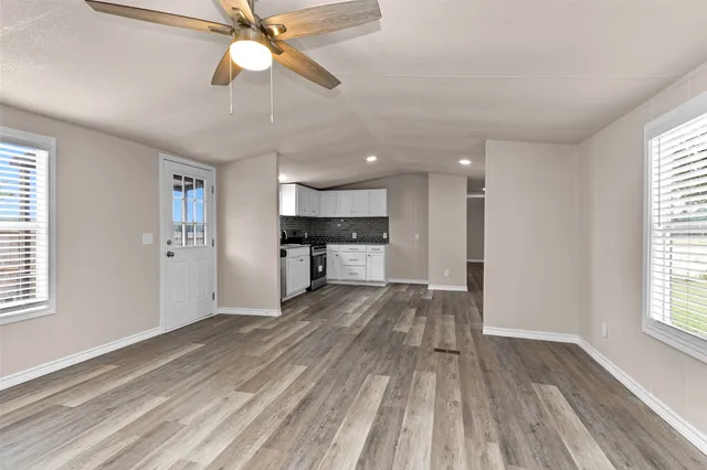 a view of kitchen with sink and wooden floor