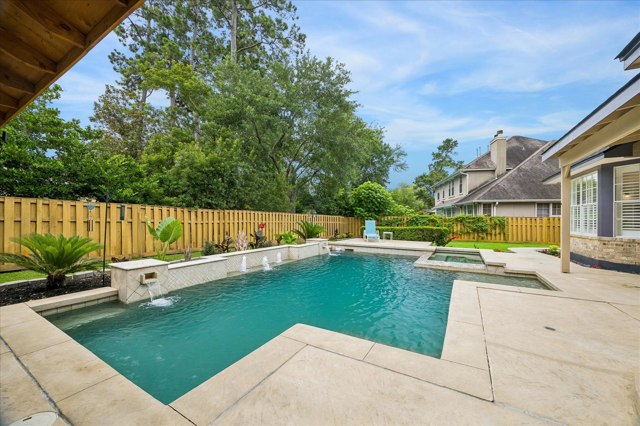 15 West Beckonvale Circle The Woodlands, TX 77382 - Photo 37 of 44 The sparkling pool and spa echo the home's architecture and refined style. Whether you are hosting or unwinding after a long day, this inviting outdoor space offers an effortless blend of ambiance and comfort.