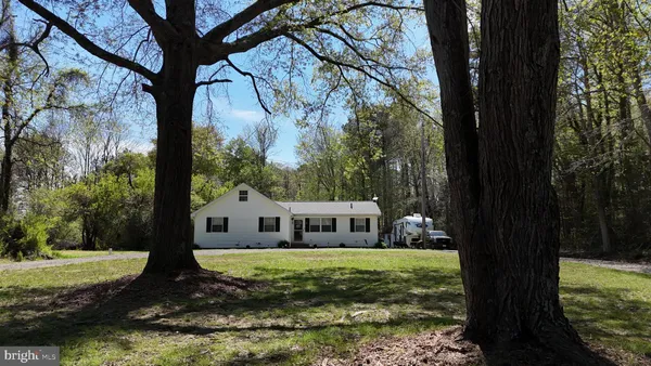 a view of house with backyard
