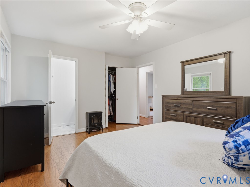 7707 Woodbrook Road Quinton, VA 23141 - Photo 29 of 42 Bedroom featuring hardwood flooring, white walls,