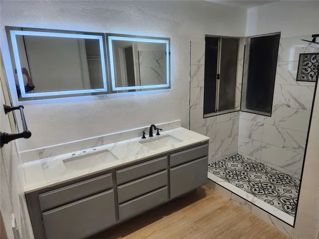a bathroom with a sink and a mirror