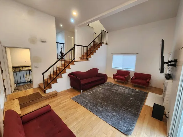 a living room with lots of furniture and a flat screen tv