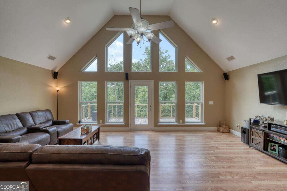 4165 Mobile Road, Unit 4 McCaysville, GA 30555 - Photo 16 of 52 a living room with furniture and a large window