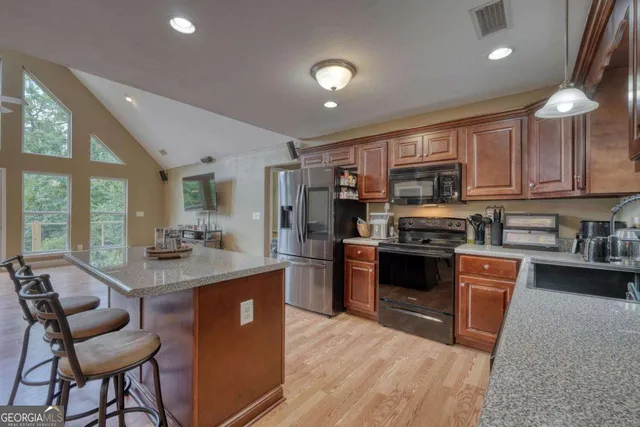 a kitchen that has a table and chairs in it