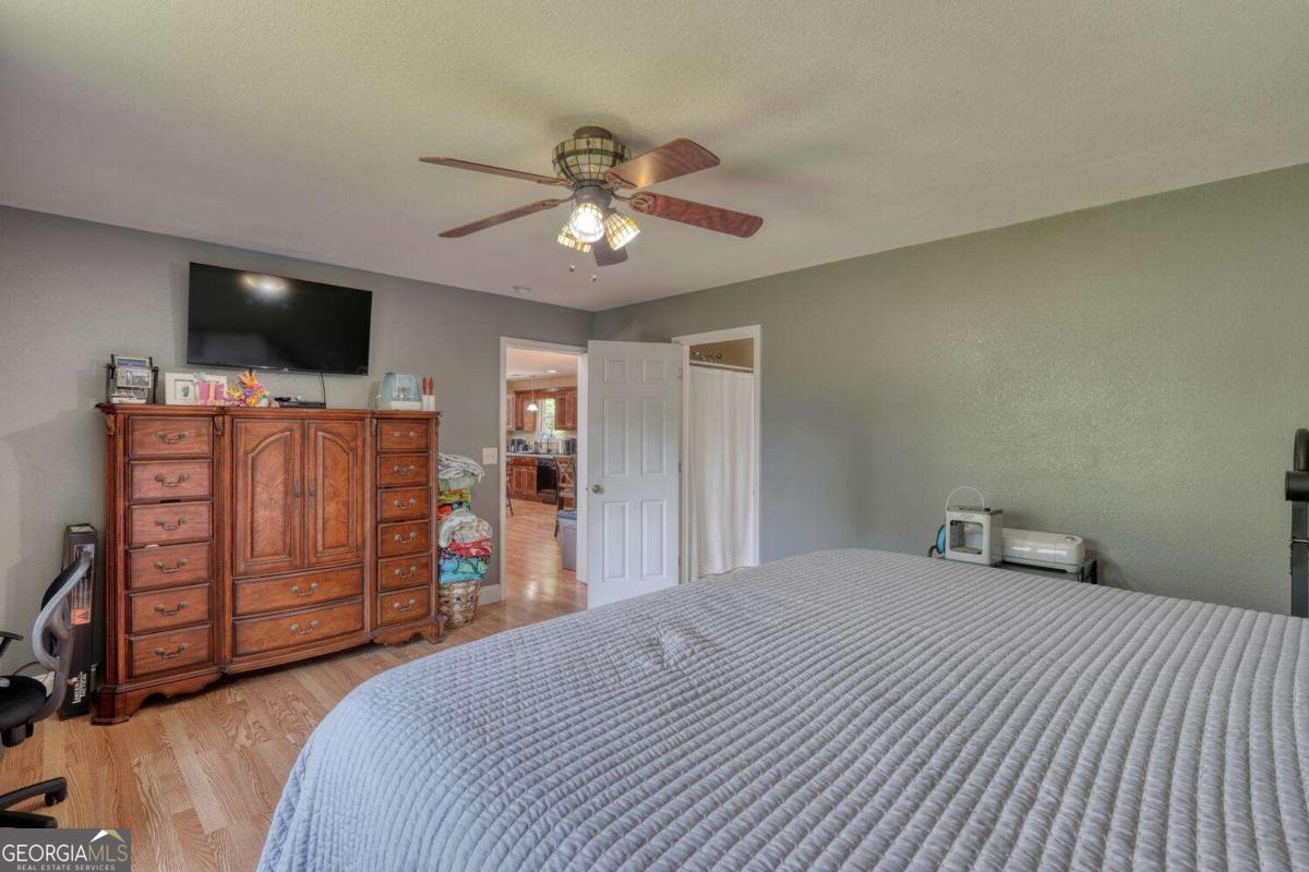 4165 Mobile Road, Unit 4 McCaysville, GA 30555 - Photo 26 of 52 a bedroom with a bed and a flat screen tv