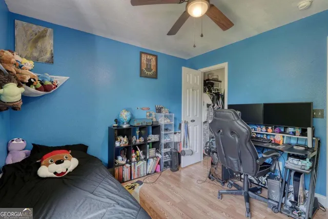 a bedroom with furniture and a window