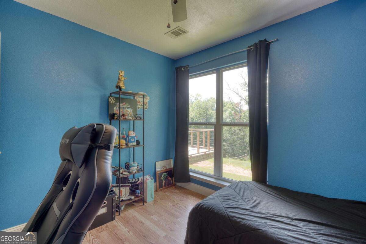 4165 Mobile Road, Unit 4 McCaysville, GA 30555 - Photo 32 of 52 a bedroom with furniture and a window