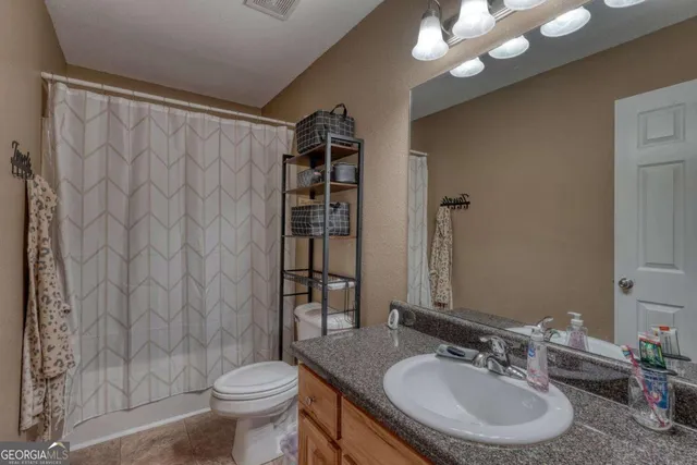 a bedroom with a bed and furniture