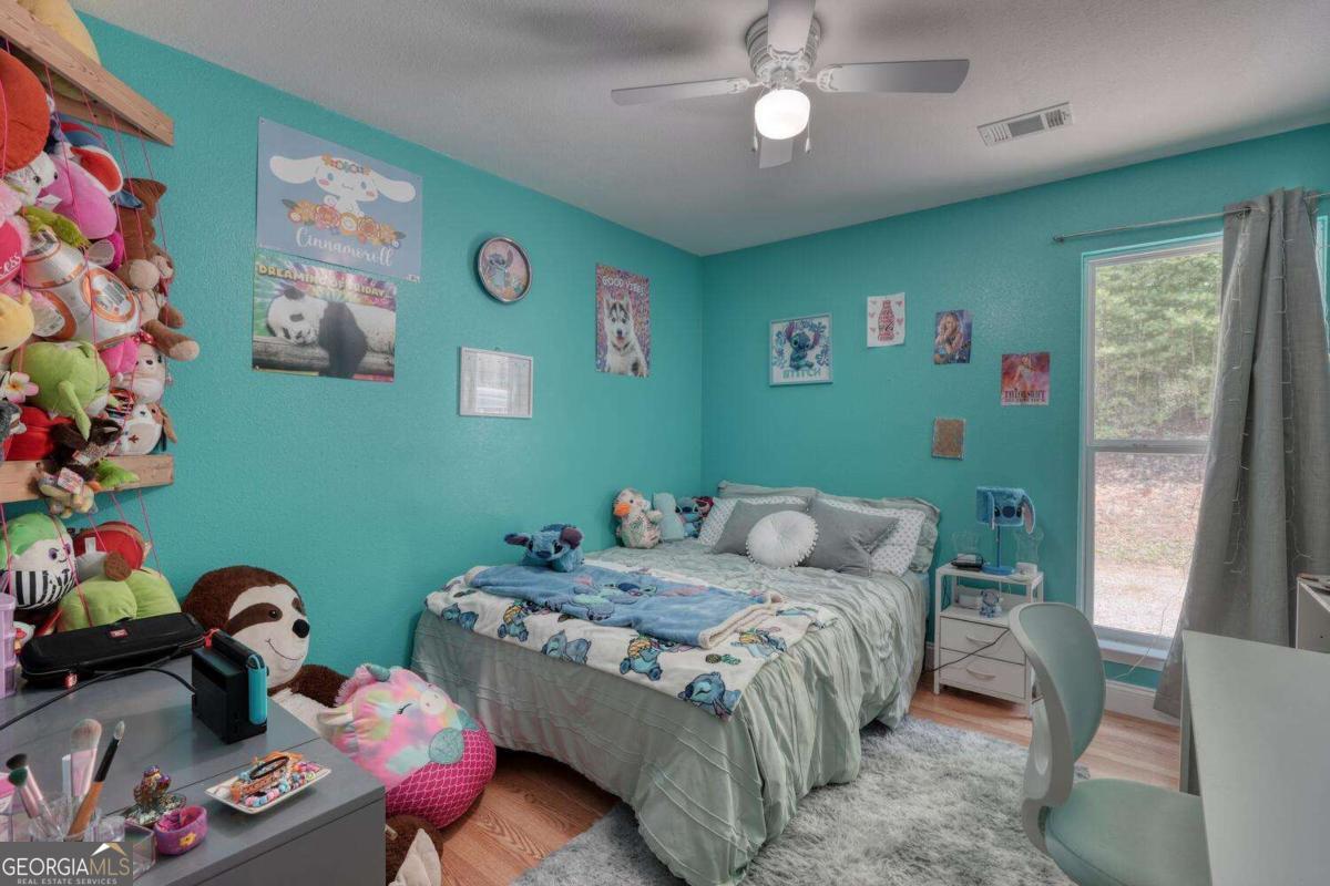 4165 Mobile Road, Unit 4 McCaysville, GA 30555 - Photo 34 of 52 a bedroom with a bed and furniture