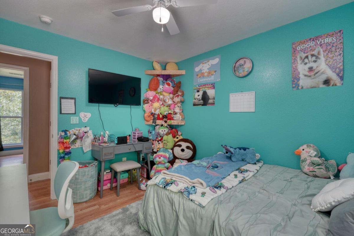 4165 Mobile Road, Unit 4 McCaysville, GA 30555 - Photo 36 of 52 a bedroom with a bed and a tv