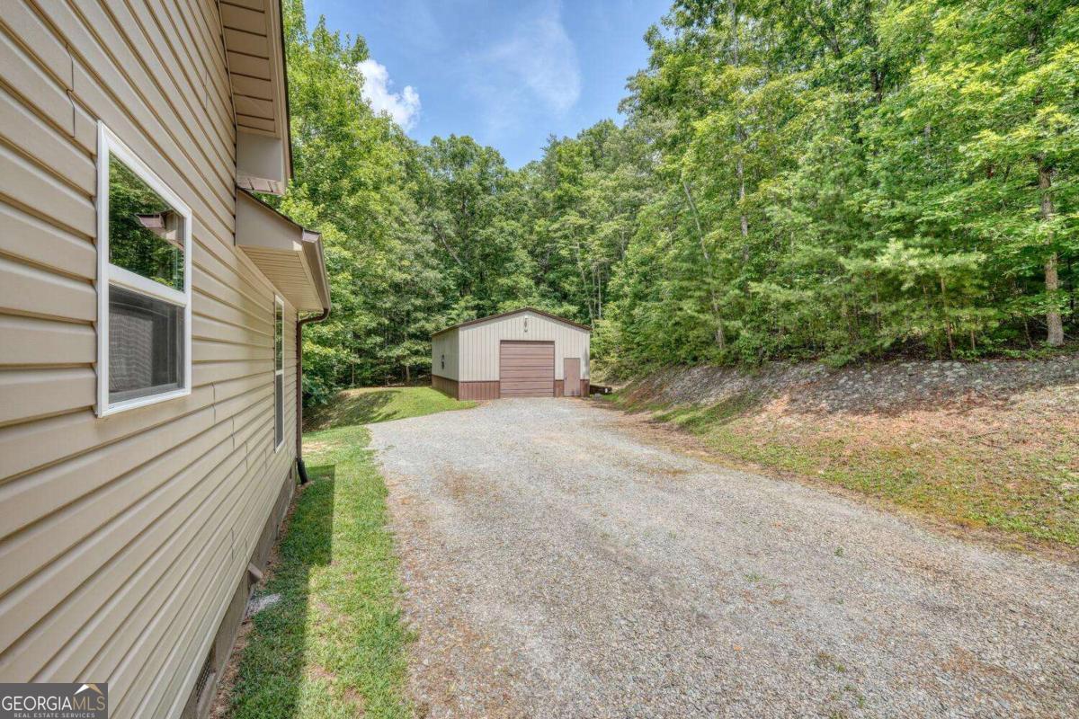 4165 Mobile Road, Unit 4 McCaysville, GA 30555 - Photo 38 of 52 a view of a back yard with a house