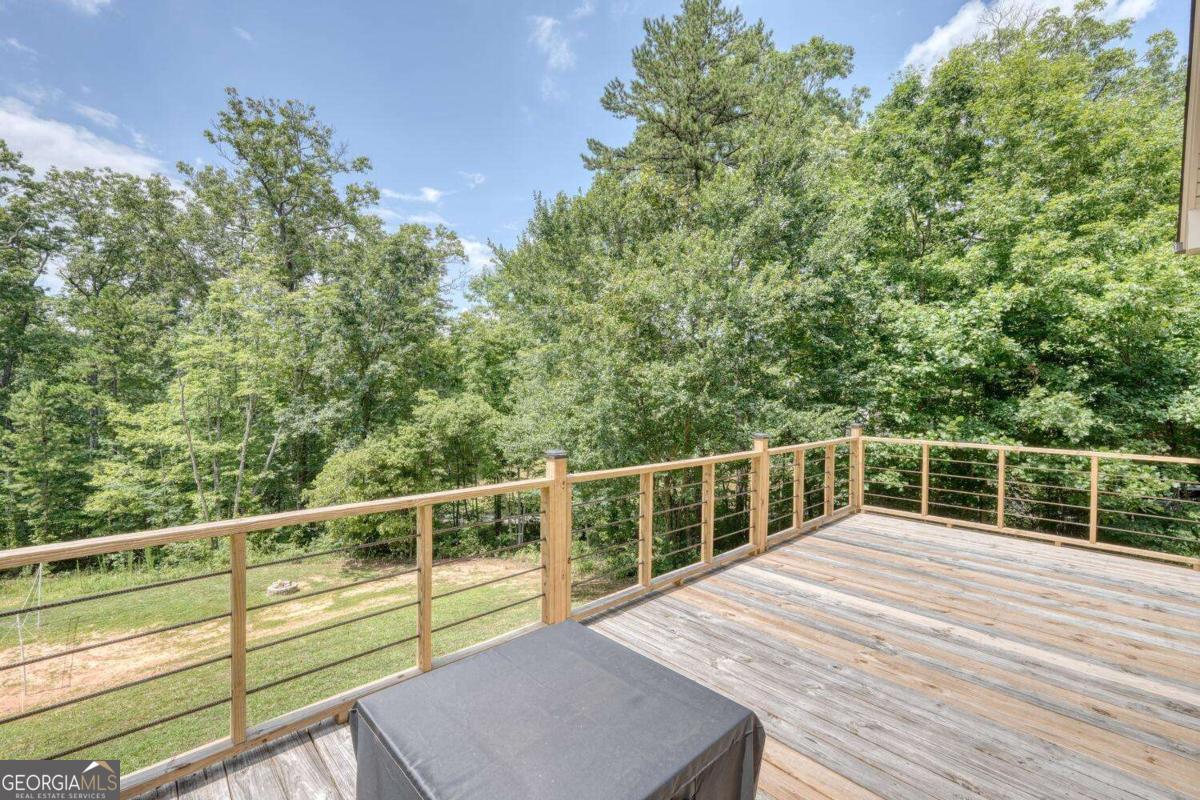 4165 Mobile Road, Unit 4 McCaysville, GA 30555 - Photo 42 of 52 a view of a balcony with wooden floor and fence