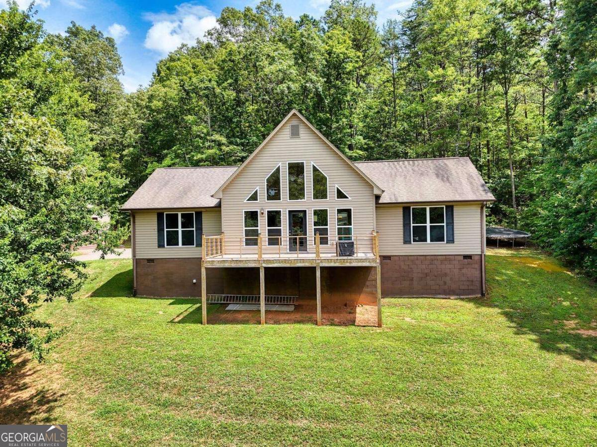4165 Mobile Road, Unit 4 McCaysville, GA 30555 - Photo 5 of 52 a front view of a house with a garden and yard