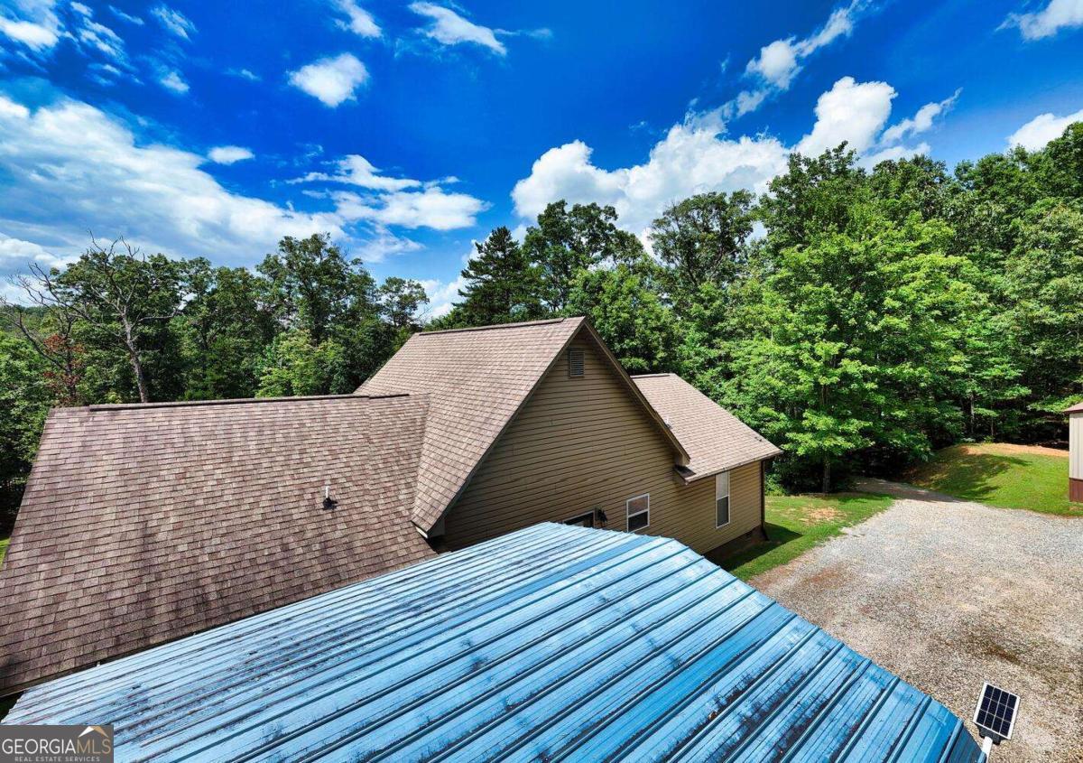 4165 Mobile Road, Unit 4 McCaysville, GA 30555 - Photo 7 of 52 a view of a house with a backyard