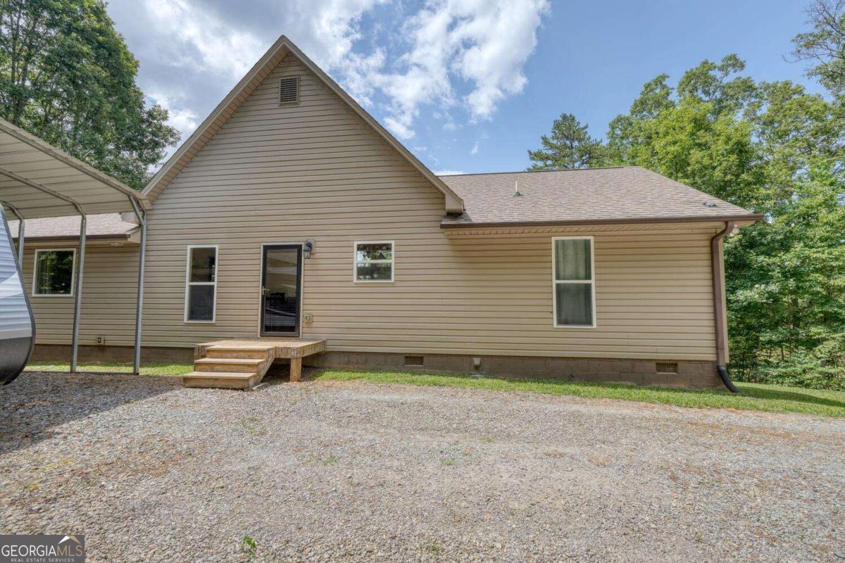4165 Mobile Road, Unit 4 McCaysville, GA 30555 - Photo 10 of 52 a view of a house with a yard and large tree