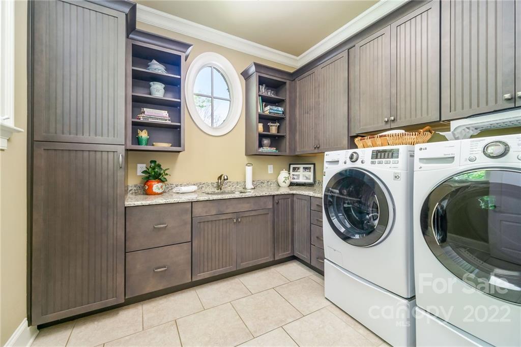 2226 Vernon Drive Charlotte, NC 28211 - Photo 13 of 44 a utility room with sink dryer and washer