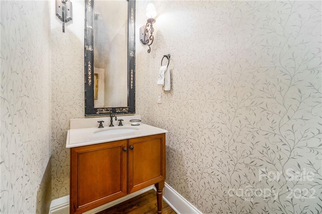 2226 Vernon Drive Charlotte, NC 28211 - Photo 15 of 44 a bathroom with a sink and mirror