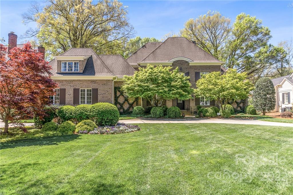 2226 Vernon Drive Charlotte, NC 28211 - Photo 2 of 44 a front view of a house with a yard and potted plants