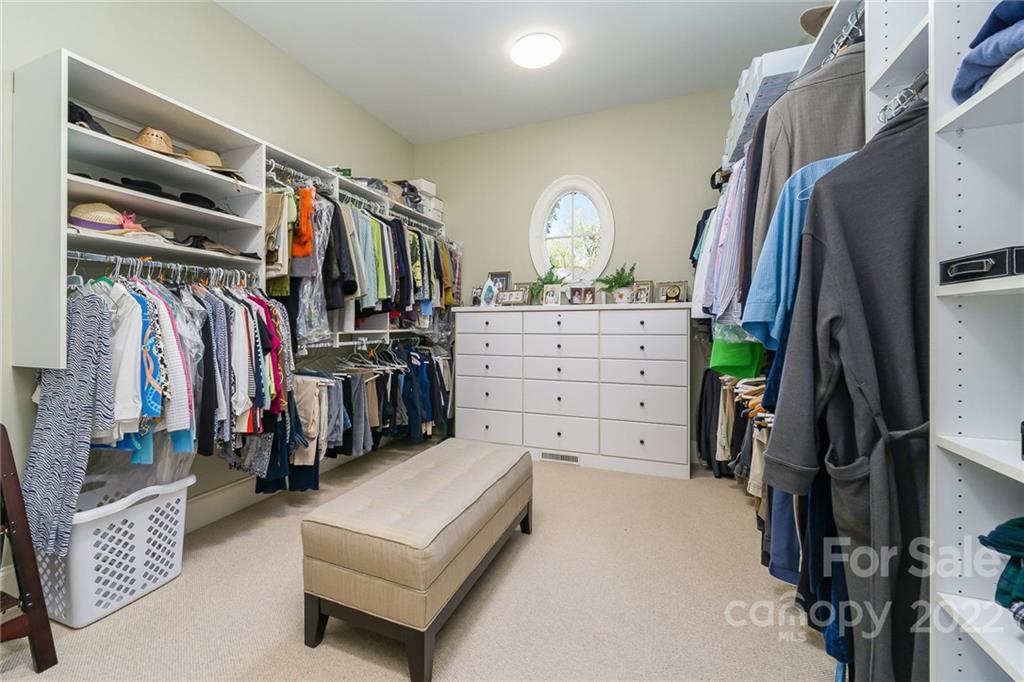 2226 Vernon Drive Charlotte, NC 28211 - Photo 22 of 44 a view of walk in closet with clothes and shoes