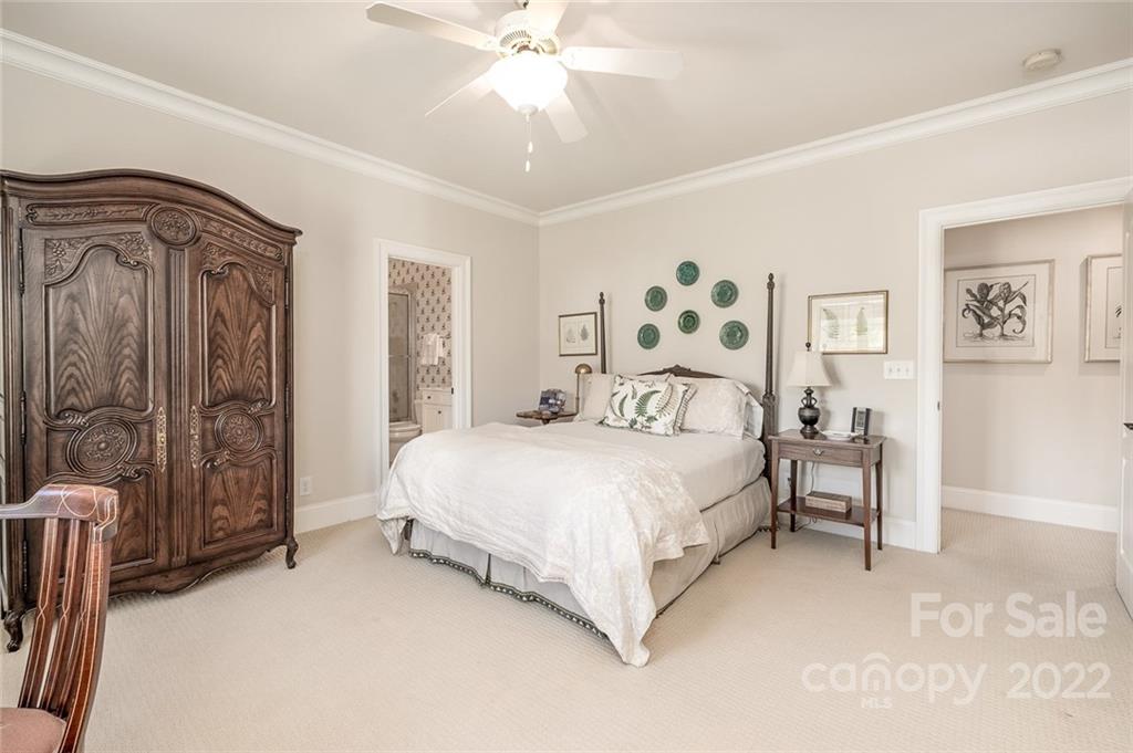 2226 Vernon Drive Charlotte, NC 28211 - Photo 24 of 44 a bedroom with a bed and a mirror