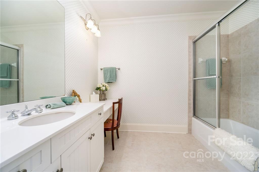 2226 Vernon Drive Charlotte, NC 28211 - Photo 28 of 44 a bathroom with a sink vanity and a mirror