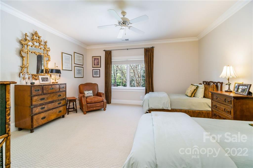 2226 Vernon Drive Charlotte, NC 28211 - Photo 29 of 44 a bedroom with furniture and a chandelier