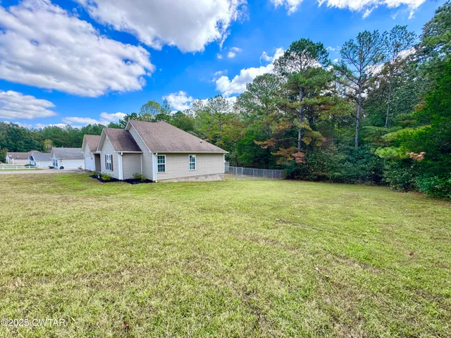 a front view of a house with yard