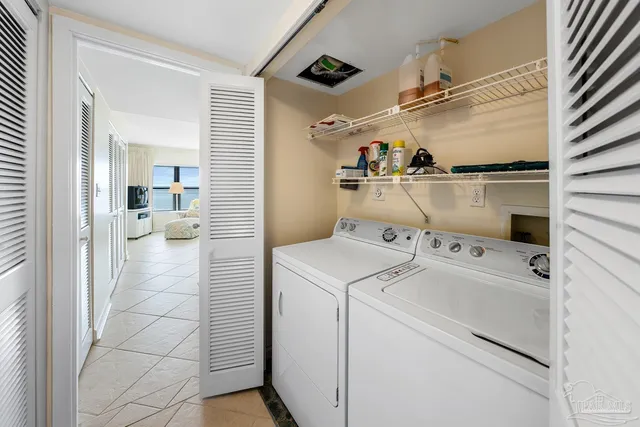 a view of storage and utility room with washer and dryer