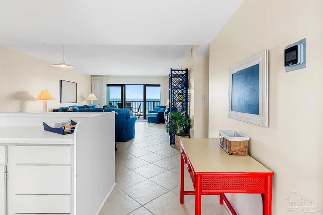 a living room with a sink and a table