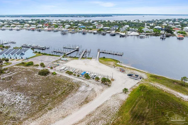 an aerial view of a house with a lake view