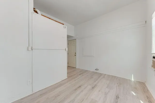 a view of small space with wooden floor