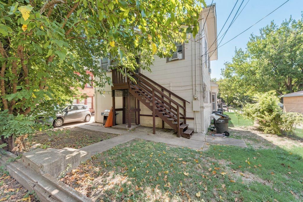 1615 Alston Avenue, Unit C Fort Worth, TX 76104 - Photo 10 of 10 a view of a house with a yard