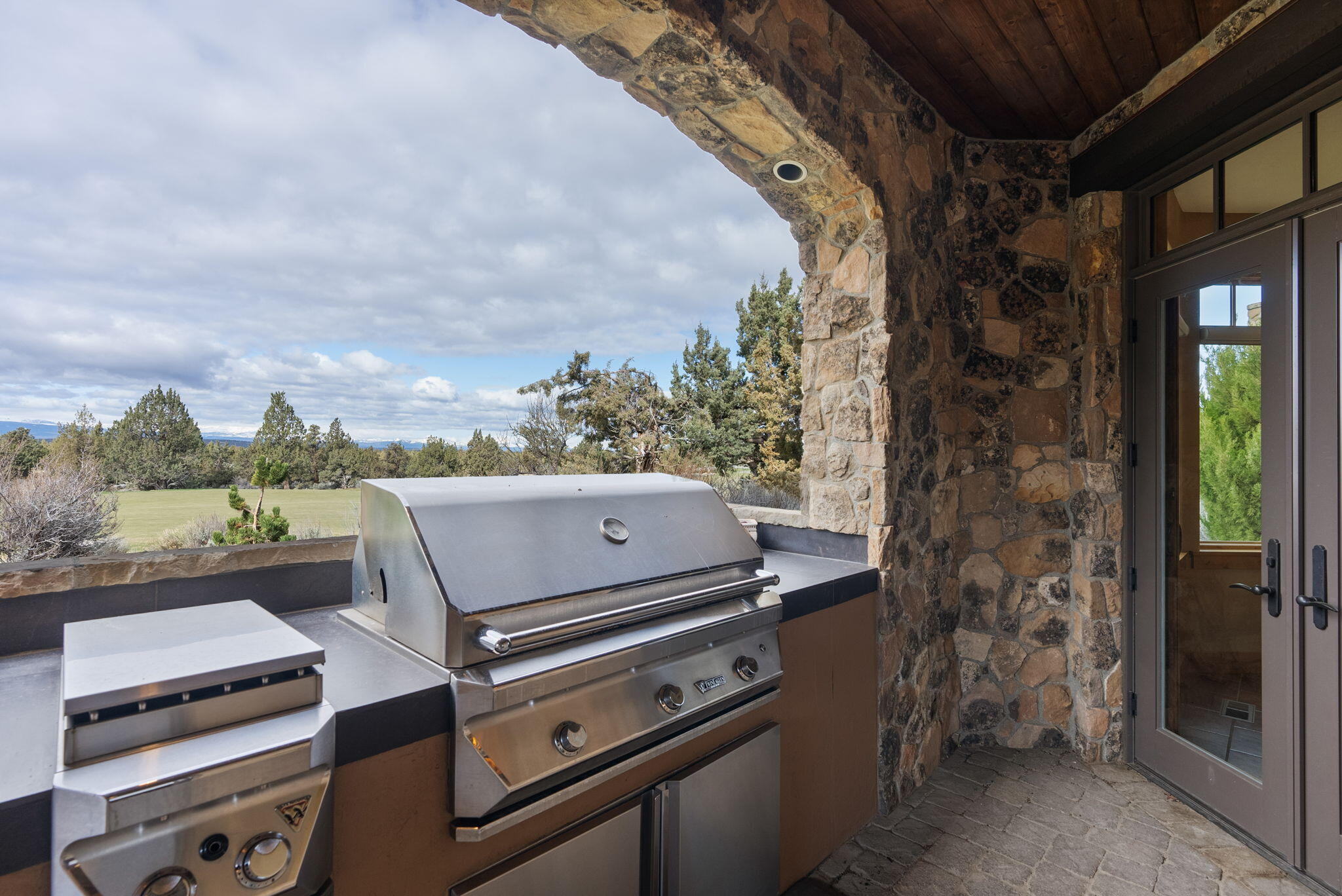 22887 Ghost Tree Lane Bend, OR 97701 - Photo 35 of 97 Enjoy the Fazio course and Cascade Mountain views while grilling on the built-in BBQ.