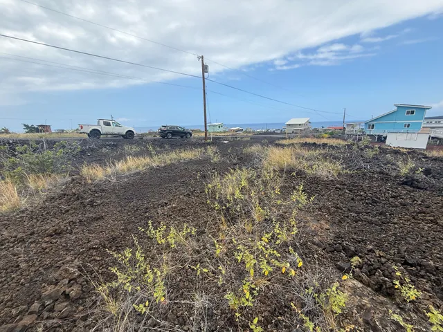 a view of a road with an ocean view